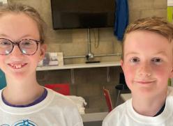 A smiling girl and boy from Little Miracles