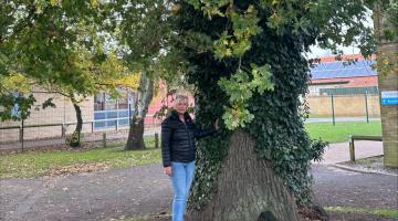 Cllr Julia Huffer beneath an oak tree